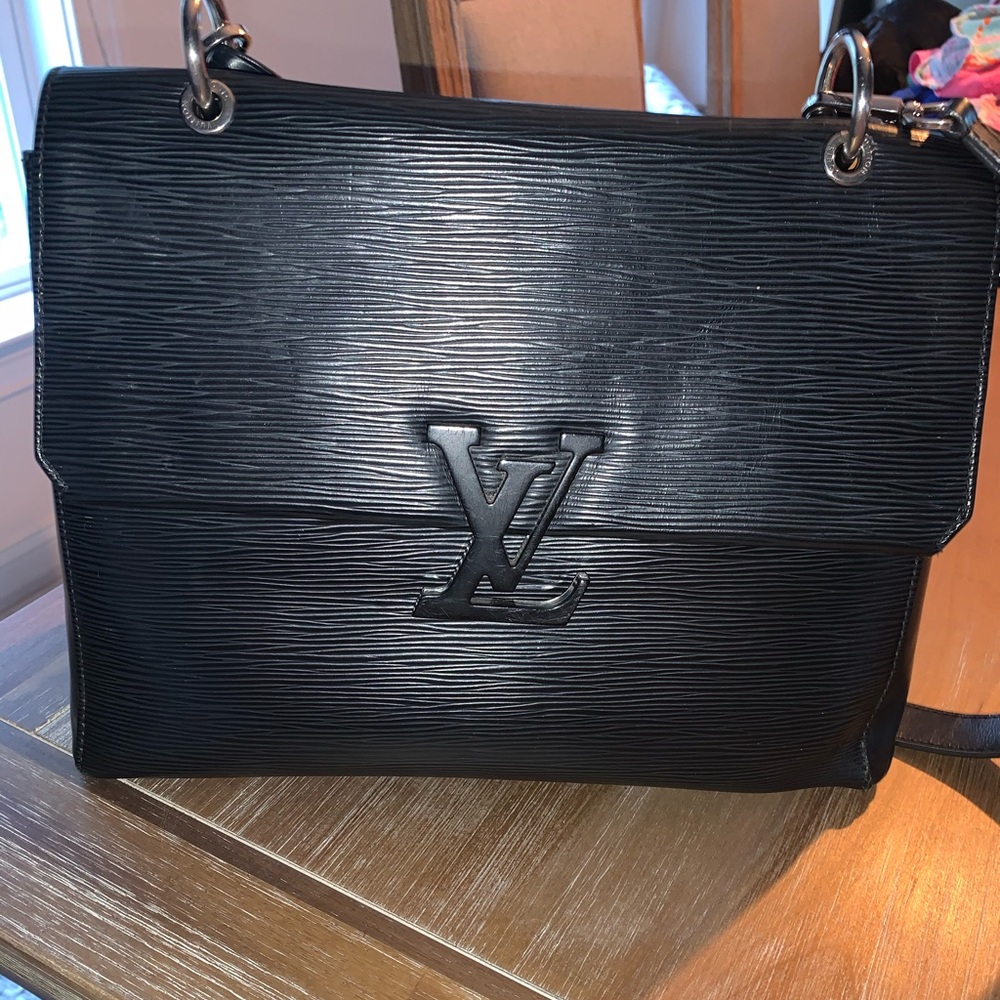 Authentic Louis Vuitton bag and matching wallet.